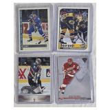 Lot of 4 Hockey Cards Featuring Ray Bourque, Steve Yzerman, Joe Sakic, and Patrick Roy.