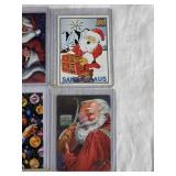 Lot of 9 Santa Claus Sports Cards Featuring Various Brands and Themes