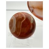 Polychrome Jasper Polished lot of 3: heart 340 gm./12 oz., round palmstone 185 gm./6.5 oz., round palmstone 116 gm./4.1 oz.