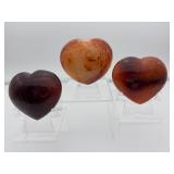 Carnelian Lot of 3 polished hearts: large puffy heart 263 gm./9.3 oz., darker heart 158 gm./4.2 oz., heart 149 gm./5.3 oz.