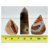 Carnelian 3-piece polished lot: obelisk 267 gm/9.4 oz., banded flames 182 gm./6.4 oz., 122 gm./4.3 oz.