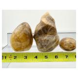 Golden Healer (yellow hematoid quartz): 3-piece lot: flame 401 gm./14.1 oz., freeform 317 gm./11.2 oz. and palmstone 96 gm./3.4 oz.