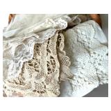 Vintage Lace Doilies and Table Linens Collection in Wicker Basket Vintage Lace Doilies and Table Linens Collection in Wicker Basket