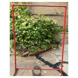 Red Metal Pipe Frame Clothing Stand and Roll of Perforated Metal Red Metal Pipe Frame Clothing Stand and Roll of Perforated Metal