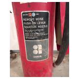 Older Fire Extinguisher with Hose and Nozzle