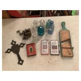 Vintage Household Items Including Glass Insulators, Bottles, and Kitchen Utensils