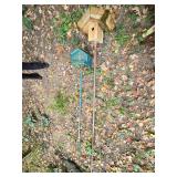 Birdhouse and Bird Feeder on Poles