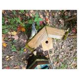 Birdhouse and Bird Feeder on Poles