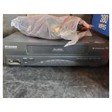 Sylvania VHS and Boxes of Various VHS Tapes to include Disney, John Wayne and much more