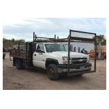 2007 White Chevy 3500 Diesel truck, flatbed with side rails, rack extending over the cab