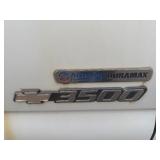 2007 White Chevy 3500 Diesel truck, flatbed with side rails, rack extending over the cab