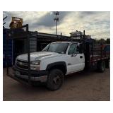 2007 White Chevy 3500 Diesel truck, flatbed with side rails, rack extending over the cab