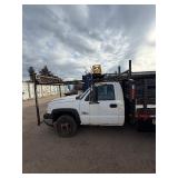 2007 White Chevy 3500 Diesel truck, flatbed with side rails, rack extending over the cab