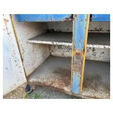 Metal workbench or tool cabinet with 2 drawers and 2 lower cabinet doors.