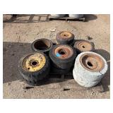 Pallet of (11) Industrial tires and rims, likely for heavy yard equipment
