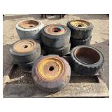 Pallet of (11) Industrial tires and rims, likely for heavy yard equipment