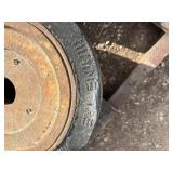 Pallet of (11) Industrial tires and rims, likely for heavy yard equipment