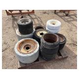 Pallet of Industrial tires and rims, likely for heavy yard equipment