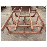 Heavy-duty industrial rolling cart probably designed for transporting pipes or beams 62 ¾” l x 48” w x 33”