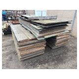 Industrial Steel pallet racking cross beams/uprights, disassembled. Plywood sheets for shelves.