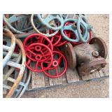 Pallet of valve hand wheels and protective frames. One valve body.
