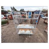 Metal rolling storage cart or cage with two fixed shelves 70” x 48”