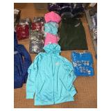 5 shelves of MN, WI, Iowa apparel various sizes designs & colors