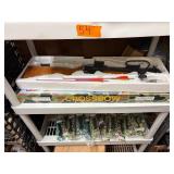 Crossbow and everything  on that shelf plus All Blow darts on floor