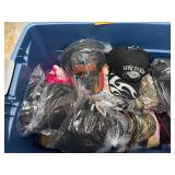 Tub (included) of hats, vinyl decals, lip balm holders
