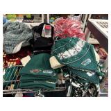 Winter hats, baseball caps and flags (top shelf)