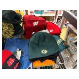 Winter hats, baseball caps and flags (top shelf)