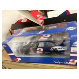 NASCAR lighters, cars, shirts, can coolers, blankets, flasks, desk set, hats, and license plates