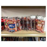 NASCAR lighters, cars, shirts, can coolers, blankets, flasks, desk set, hats, and license plates