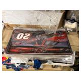 NASCAR lighters, cars, shirts, can coolers, blankets, flasks, desk set, hats, and license plates