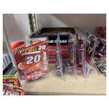 NASCAR lighters, cars, shirts, can coolers, blankets, flasks, desk set, hats, and license plates