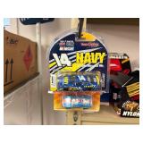 NASCAR lighters, cars, shirts, can coolers, blankets, flasks, desk set, hats, and license plates