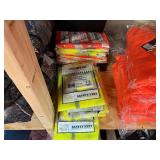 3 shelves of camo/orange hunting gear. Jackets, sweatshirts, hats, foam footballs