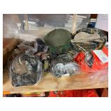 3 shelves of camo/orange hunting gear. Jackets, sweatshirts, hats, foam footballs