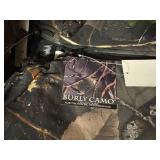 3 shelves of camo/orange hunting gear. Jackets, sweatshirts, hats, foam footballs