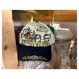 3 shelves of camo/orange hunting gear. Jackets, sweatshirts, hats, foam footballs