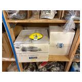 3 shelves of camo/orange hunting gear. Jackets, sweatshirts, hats, foam footballs