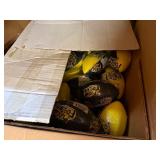 3 shelves of camo/orange hunting gear. Jackets, sweatshirts, hats, foam footballs