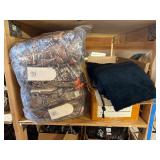 3 shelves of camp hunting gear