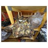 3 shelves of camo/orange hunting gear