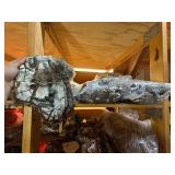 3 shelves of camo/orange hunting gear