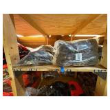 3 shelves of camo/orange hunting gear