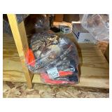 3 shelves of camo/orange hunting gear