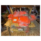 3 shelves of camo/orange hunting gear