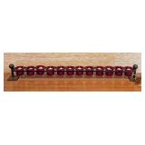 LL - Jan Barboglio Long Wrought Iron Votive Candle Holder with 12 Red Glass Votive Holders