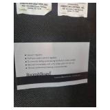 A Modern Round Brown Leather Coffee Table / Ottoman by Room and Board.